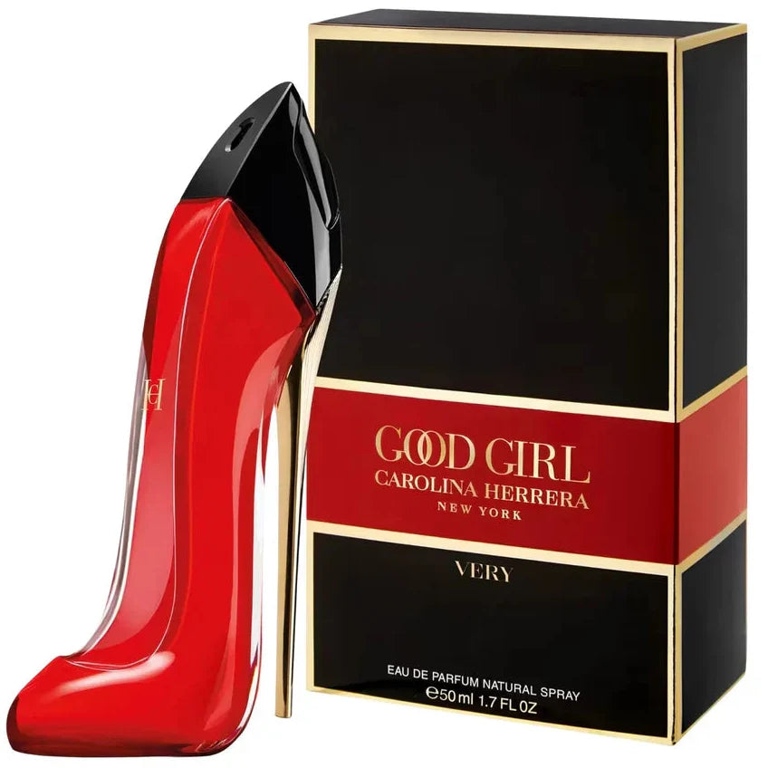 Red high-heeled shoe-shaped perfume bottle with black cap next to its packaging on a white background