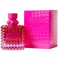Valentino perfume bottle and packaging with pink design on a white background